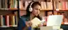 Girl Looking At Laptop And Books